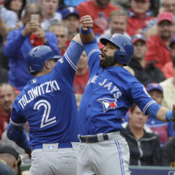 Toronto Blue Jays' Troy Tulowitzki (2) and Jose Bautista, right, celebrate Tulowitzki's two-run home run that scored Bautista in the second inning of Game 2 of baseball's American League Division Series against the Texas Rangers on Friday, Oct. 7, 2016, in Arlington, Texas. (AP Photo/David J. Phillip) ORG XMIT: ARL116